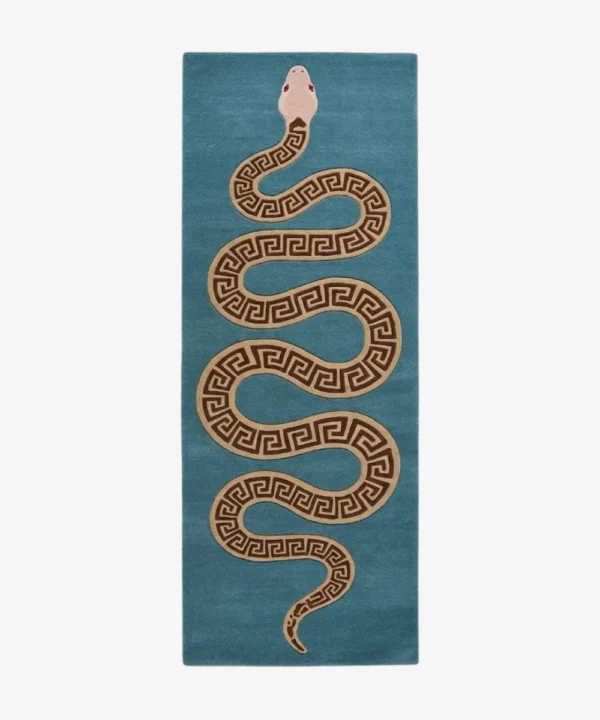 An overhead studio shot of the rectangular Azure Serpent Runner rug featuring a winding Greek key patterned snake on a vibrant teal background.