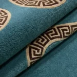 A macro view highlighting the premium wool pile texture and the intricate geometric details of the Azure Serpent runner rug.