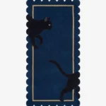 Full top-down view of the rectangular Black Cat runner rug isolated on a white background, featuring a playful black cat graphic, a navy blue base, a beige inner frame, and scalloped edges.