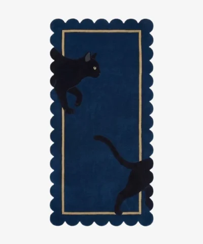 Full top-down view of the rectangular Black Cat runner rug isolated on a white background, featuring a playful black cat graphic, a navy blue base, a beige inner frame, and scalloped edges.