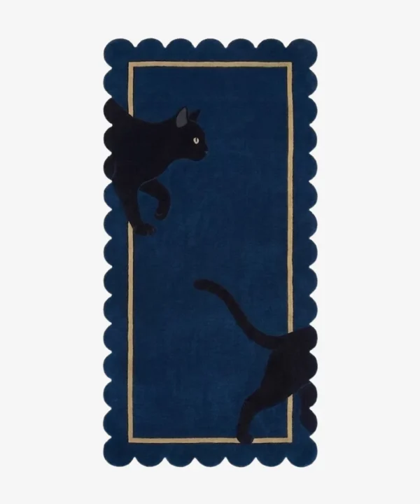 Full top-down view of the rectangular Black Cat runner rug isolated on a white background, featuring a playful black cat graphic, a navy blue base, a beige inner frame, and scalloped edges.