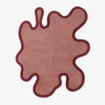 Full top-down view of the asymmetrical Blush Drift rug isolated against a plain white background, emphasizing its flat fluid shape and bold outlines.