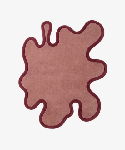 Full top-down view of the asymmetrical Blush Drift rug isolated against a plain white background, emphasizing its flat fluid shape and bold outlines.