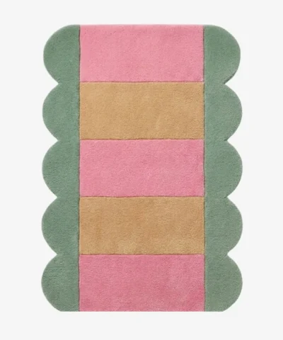 Full top-down product isolated shot of the Candy Stripe scalloped runner rug featuring alternating pink and beige horizontal blocks with a sage green wavy border.