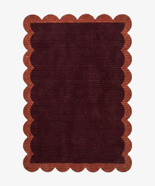 Full top-down view of the rectangular Cinder Scallop rug isolated on a white background, highlighting the solid flat color blocks and uniform scalloped edge pattern.