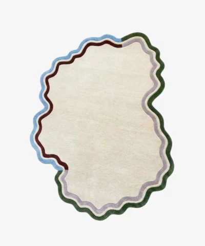 Full top-down product isolated shot of the cream Cloudline Scallop irregular area rug featuring multi-colored wavy borders in green, purple, brown, and blue.