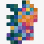 Full top-down product isolated shot of the uniquely shaped Color Matrix checkered irregular rug showcasing a vibrant multicolored grid pattern.