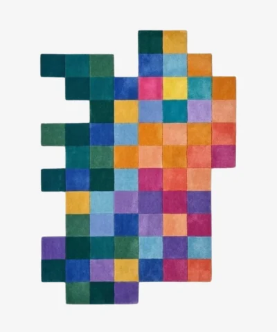 Full top-down product isolated shot of the uniquely shaped Color Matrix checkered irregular rug showcasing a vibrant multicolored grid pattern.