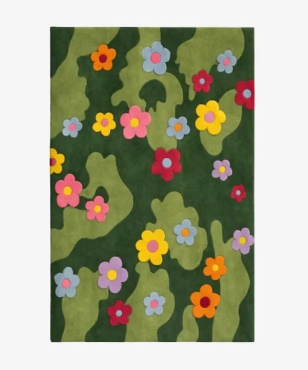 Full top-down product isolated shot of the dark green Daisy Bloom rug featuring a playful pattern of multicolored daisies.