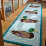 Perspective interior shot of the Drifting Mallards runner rug styled in a long hallway on a light wood floor.