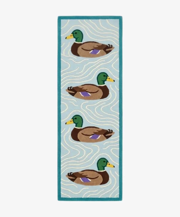 Full top-down product isolated shot of the rectangular light blue runner rug featuring a recurring mallard duck pattern.
