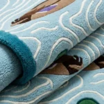 Close-up macro photograph highlighting the thick, plush wool material texture and detailed tufting of the Drifting Mallards runner rug.