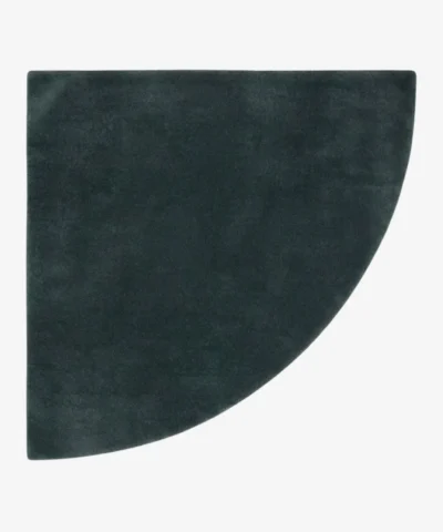 Full top-down product isolated shot of the uniquely shaped Eclipse Arc corner accent rug in a deep charcoal gray tone.