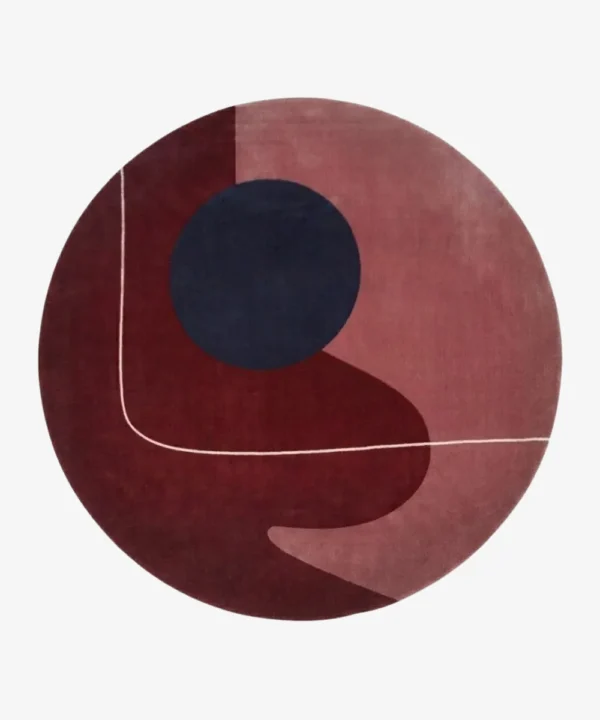 Full top-down product isolated shot of the round Eclipse area rug featuring abstract geometric blocks of burgundy, mauve, and a dark navy circle.