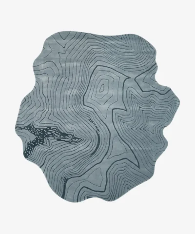 Full overhead product isolated shot of the uniquely shaped blue Glacier Terrain topographical area rug.