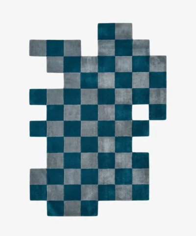 Full top-down product isolated shot of the uniquely shaped Gridlock irregular area rug featuring a teal and gray checkered pattern.