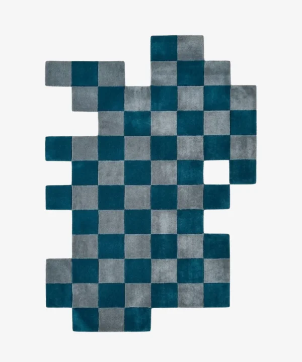 Full top-down product isolated shot of the uniquely shaped Gridlock irregular area rug featuring a teal and gray checkered pattern.