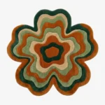 Full top-down product isolated shot of the flower-shaped Groovy irregular area rug featuring retro wavy concentric rings of forest green, terracotta, light green, and beige.