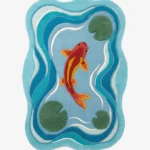 Full top-down product isolated shot of the uniquely shaped Japanese Koi Fish Garden area rug featuring a single red and yellow koi swimming in a blue pond with green lily pads.