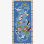Full top-down view of the rectangular Koi Fish Pond runner rug isolated on a white background, featuring swimming koi fish, green lily pads, and a stone-brick patterned border.