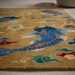 Perspective side angle of the Koi Pond rug showcasing the detailed fish design and depth of the hand-tufted pile.