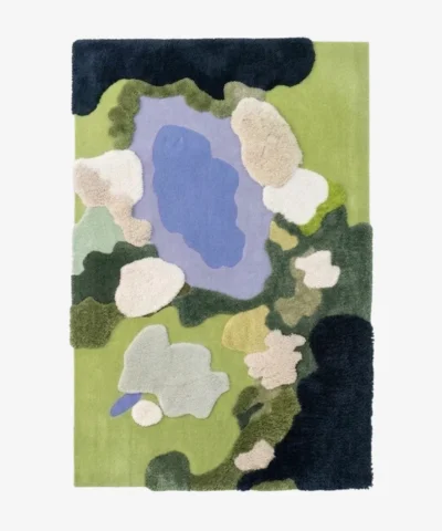 Full top-down product isolated shot of the rectangular Lilypond abstract area rug featuring a multi-level tufted landscape design with green fields, a blue water pond, and soft cream-colored lily pads.