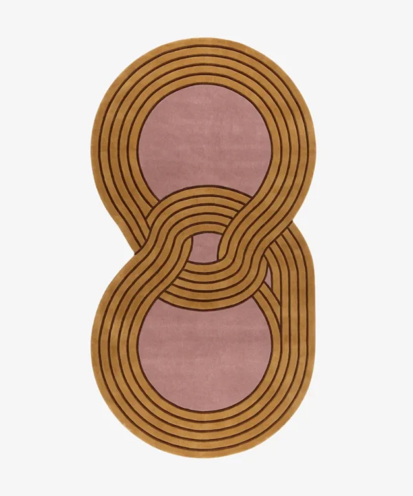 Full top-down product isolated shot of the custom figure-eight shaped Luma Loop area rug, featuring an overlapping retro geometric infinity design with multi-lined tracks in mustard gold and dusty rose pink.
