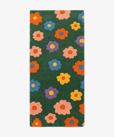 Full top-down product isolated shot of the green rectangular Meadow Bloom runner rug featuring a repeating retro pattern of colorful daisies.