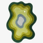 Full top-down view of the custom fluid Mireform rug isolated on a plain white background, highlighting its concentric wavy design in layered shades of green, olive, chartreuse, blue, and gray.
