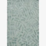 Full top-down product isolated shot of the rectangular Mist Glacis accent rug, featuring a sculptural geometric pattern of raised, multi-directional tufted brick blocks over a flat-woven sage mint green base field.
