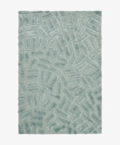 Full top-down product isolated shot of the rectangular Mist Glacis accent rug, featuring a sculptural geometric pattern of raised, multi-directional tufted brick blocks over a flat-woven sage mint green base field.