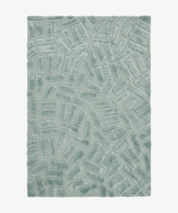 Full top-down product isolated shot of the rectangular Mist Glacis accent rug, featuring a sculptural geometric pattern of raised, multi-directional tufted brick blocks over a flat-woven sage mint green base field.