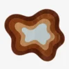Full top-down view of the custom fluid Oasis rug isolated on a plain white background, highlighting its concentric wavy design in shades of brown, terracotta, beige, and light blue.