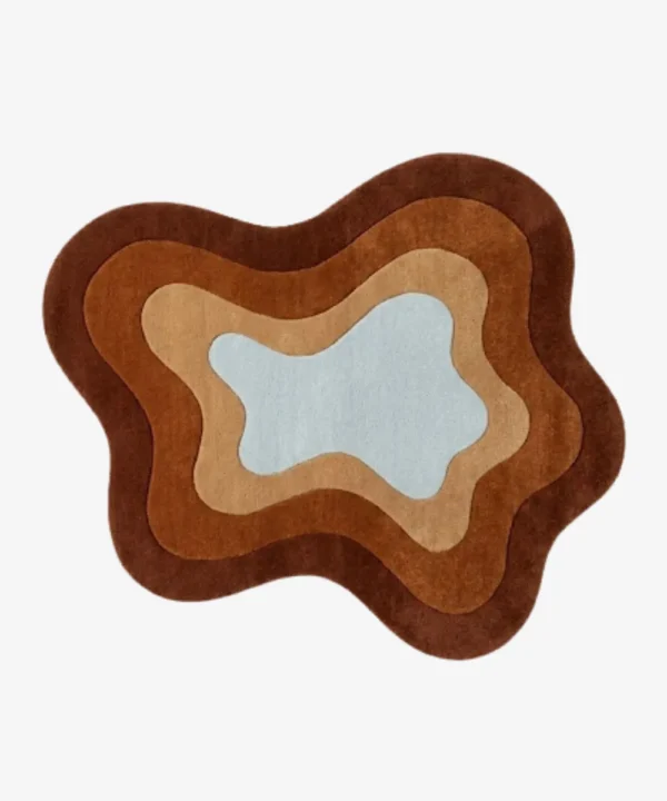 Full top-down view of the custom fluid Oasis rug isolated on a plain white background, highlighting its concentric wavy design in shades of brown, terracotta, beige, and light blue.
