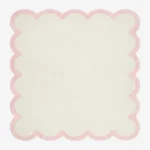 Full top-down product isolated shot of the cream and pink Opaline scalloped rug.