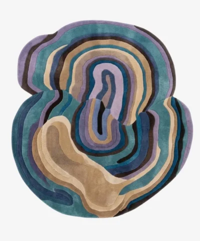 Full top-down product isolated shot of the uniquely shaped Reverb abstract rug featuring organic flowing layers in tones of teal, lavender, brown, and beige.
