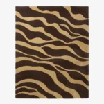 Full top-down product isolated shot of the rectangular Sable Drift area rug featuring an organic wavy abstract pattern in alternating flowing blocks of dark espresso brown and sandy beige.