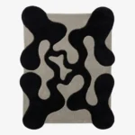 Full top-down product isolated shot of the black and gray organic-shaped Shadow Morph area rug.
