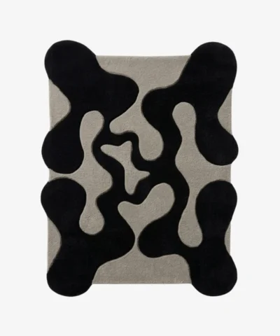 Full top-down product isolated shot of the black and gray organic-shaped Shadow Morph area rug.