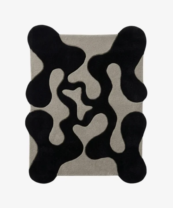 Full top-down product isolated shot of the black and gray organic-shaped Shadow Morph area rug.