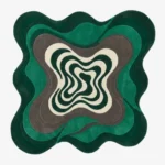 Full top-down view of the custom-shaped Strata rug isolated on a white background, featuring an organic topographical layout in layered green, gray, and off-white solid color blocks.