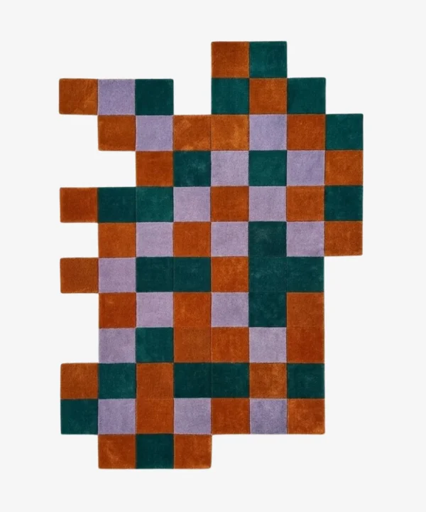Full top-down product isolated shot of the uniquely shaped Terra Mosaic irregular area rug featuring a rust, teal, and lavender checkered pattern.