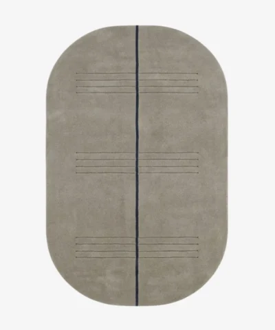 Full top-down product isolated shot of the oval-shaped Urban Meridian area rug in a muted taupe grey pile, bisected by a single dark charcoal linear element and subtle horizontal etched accent lines.