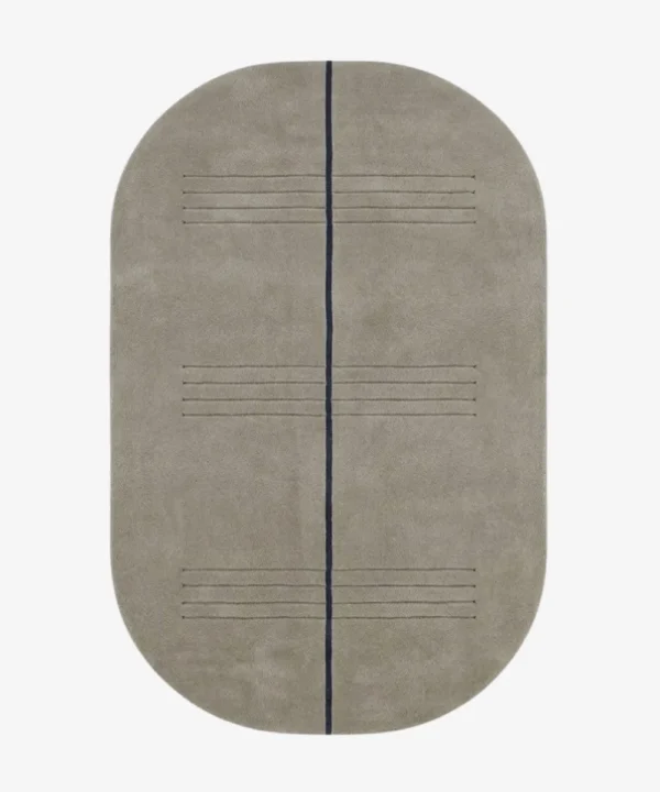 Full top-down product isolated shot of the oval-shaped Urban Meridian area rug in a muted taupe grey pile, bisected by a single dark charcoal linear element and subtle horizontal etched accent lines.