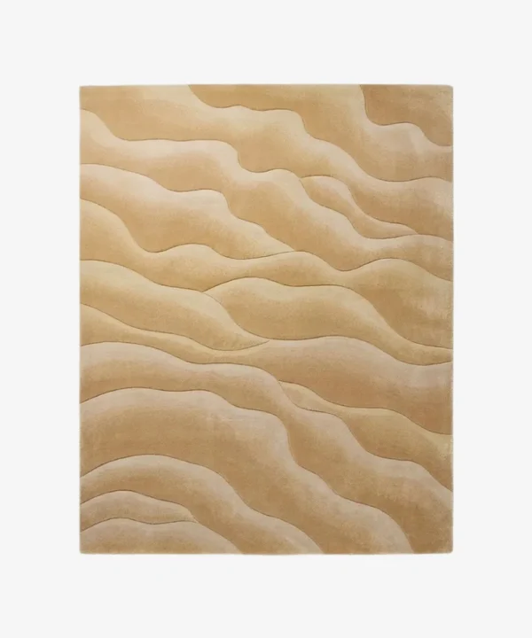 Full top-down product isolated shot of the rectangular Velune Wave area rug, featuring an organic, monochromatic undulating wave pattern in concentric layered shades of warm beige, camel, sand, and cream.