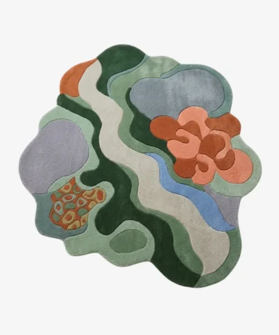 Full top-down product isolated shot of the uniquely shaped Wildgrove abstract rug featuring organic fluid shapes in green, blue, lavender, and terracotta tones.