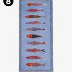 A studio product shot of the light blue rectangular runner rug, displaying its vertical sequence of stylized, hand-knotted colorful fish and fringed border.