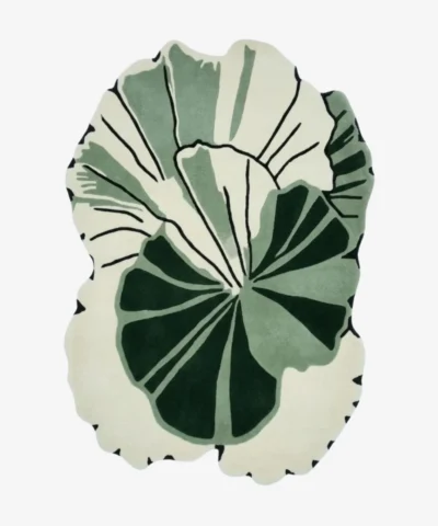 Full top-down product isolated shot of the custom-shaped Green Sanctuary area rug, featuring an organic abstract monstera or palm leaf silhouette with overlapping layers of deep forest green, sage green, and an off-white background field with thin black line detailing.