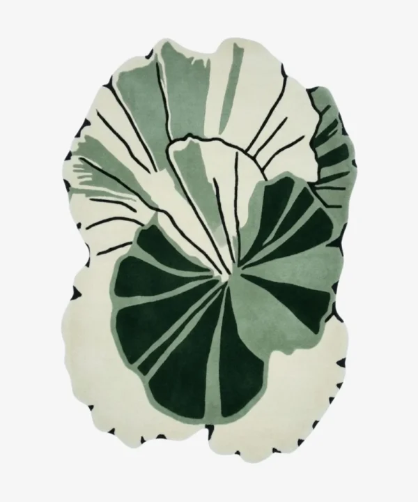 Full top-down product isolated shot of the custom-shaped Green Sanctuary area rug, featuring an organic abstract monstera or palm leaf silhouette with overlapping layers of deep forest green, sage green, and an off-white background field with thin black line detailing.