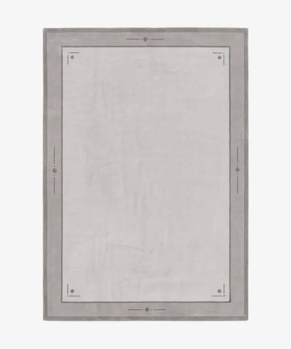 Hazeon grey and cream bordered area rug featuring geometric diamond details, displayed flat.
